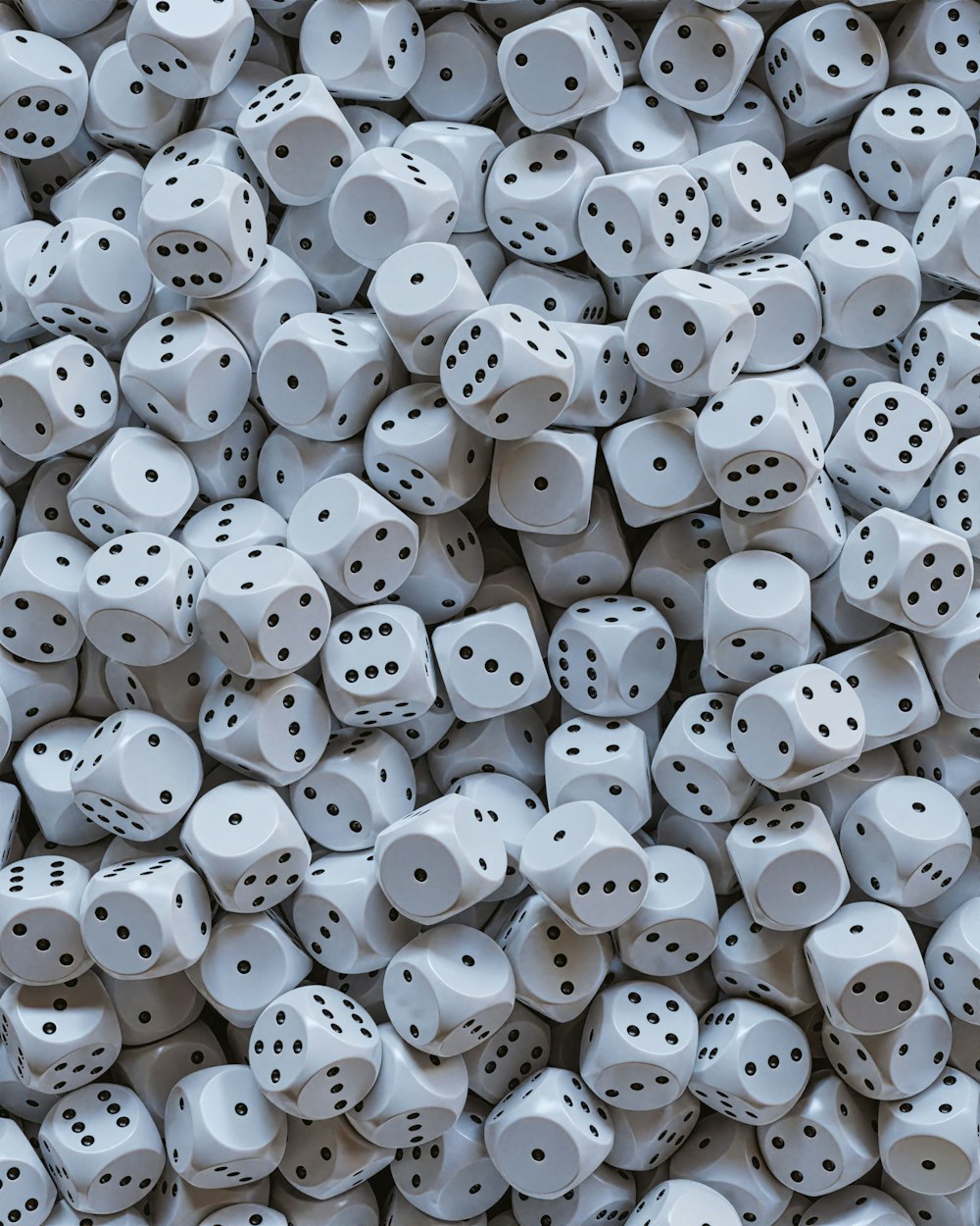 a pile of white dice with black dots