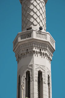 Outdoor mosque minaret with discreetly installed speakers for clear sound projection.