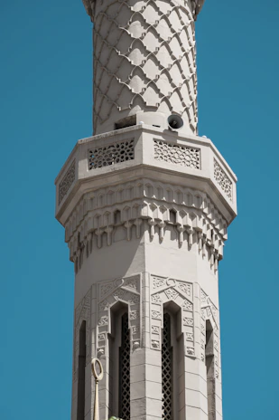 Outdoor mosque minaret with discreetly installed speakers for clear sound projection.