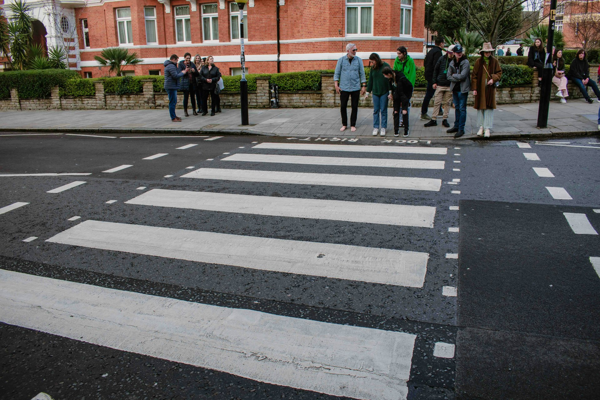 An artistic shot of The Beatles' famous Abbey Road album cover with the band crossing the street.