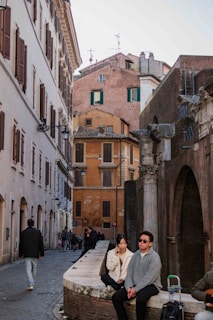 An ancient city street lined with historical architecture.