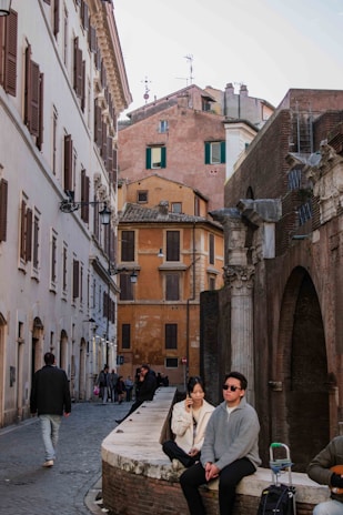 An ancient city street lined with historical architecture.