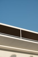 Finished residential building with clean lines and contemporary design under a clear sky.