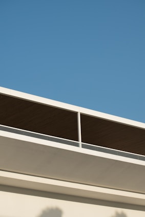Modern flat roof with sleek gray panels and clean lines