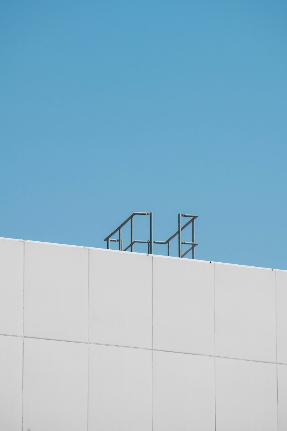 a white building with a clock on the top of it