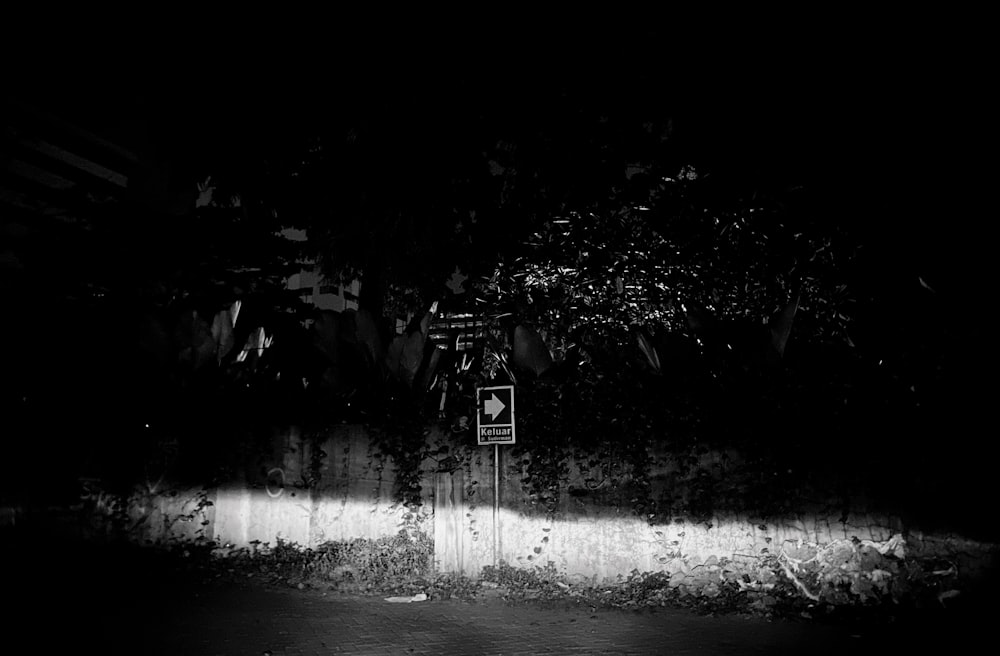 a black and white photo of a street sign