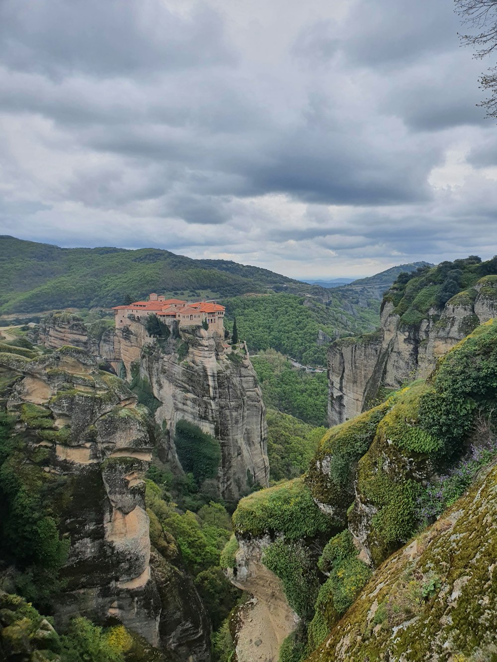 a scenic view of a castle perched on a cliff