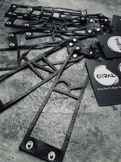 Stylish arrangement of branding materials on a black surface with golden accents