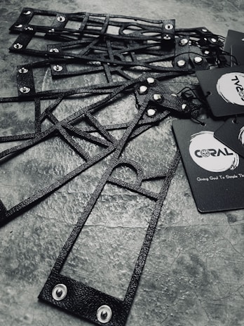 Array of finished product samples in shades of gray and black, arranged with clean lines and tech-inspired style.