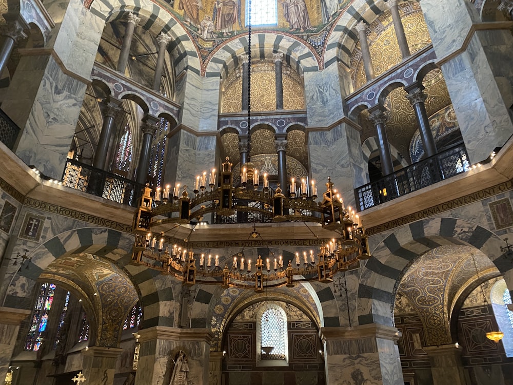 a chandelier hanging from the ceiling of a church