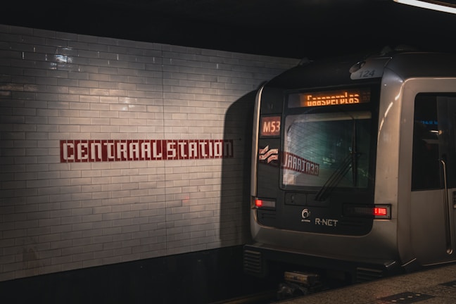a subway train pulling into a subway station