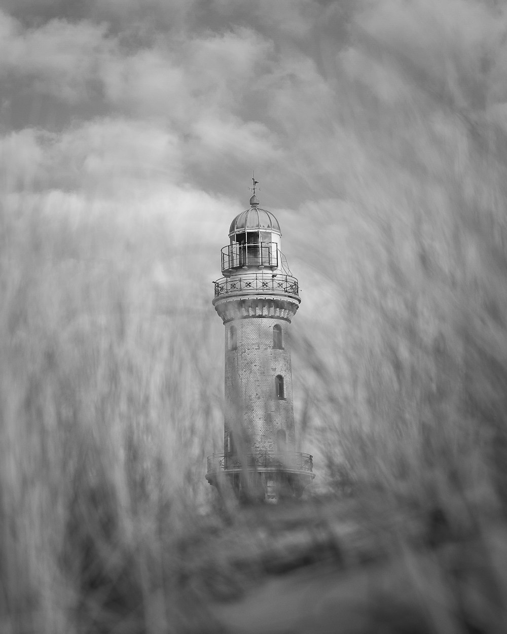 a black and white photo of a lighthouse