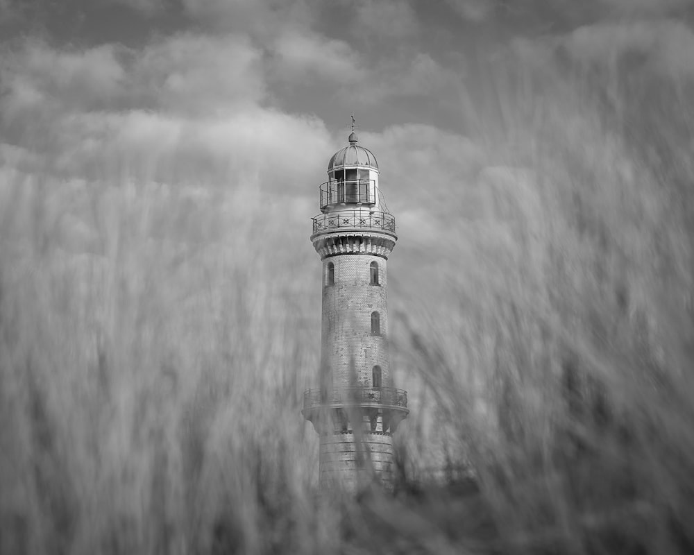 a black and white photo of a lighthouse