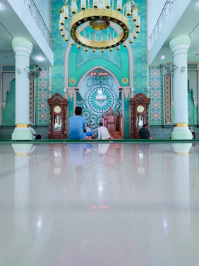 A clean, modern dashboard interface displaying masjid inventory and expense charts in emerald and white tones.