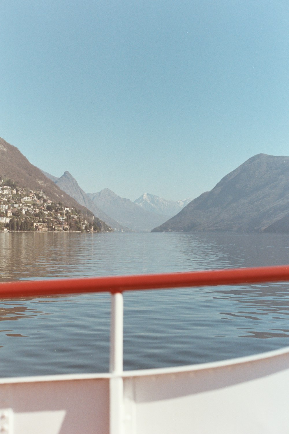 a view of a body of water with mountains in the background