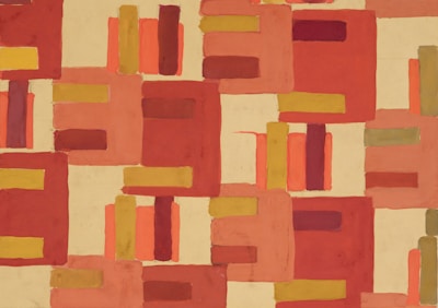 An abstract art piece composed of rectangular shapes in varying shades of red, orange, mustard yellow, and beige. The geometric forms are arranged in a seemingly random pattern, creating a sense of movement and rhythm across the canvas.