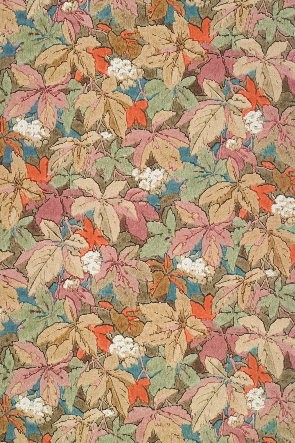 a floral pattern of leaves and flowers on a brown background