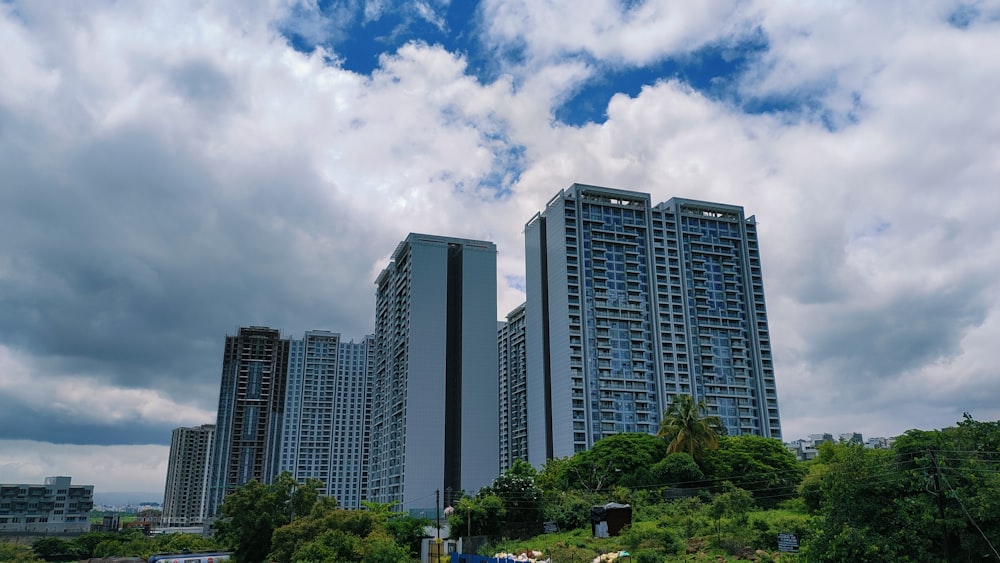 a couple of tall buildings sitting next to each other