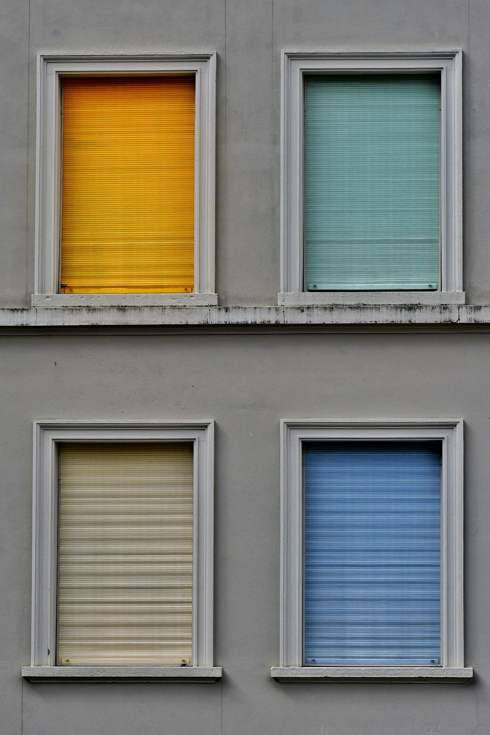 a building with four different colored windows