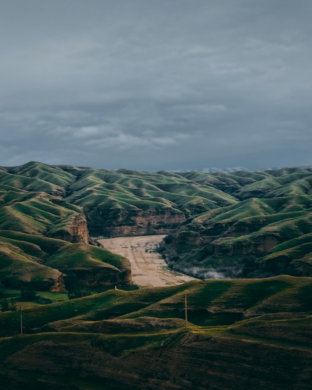 a view of a valley with a river running through it