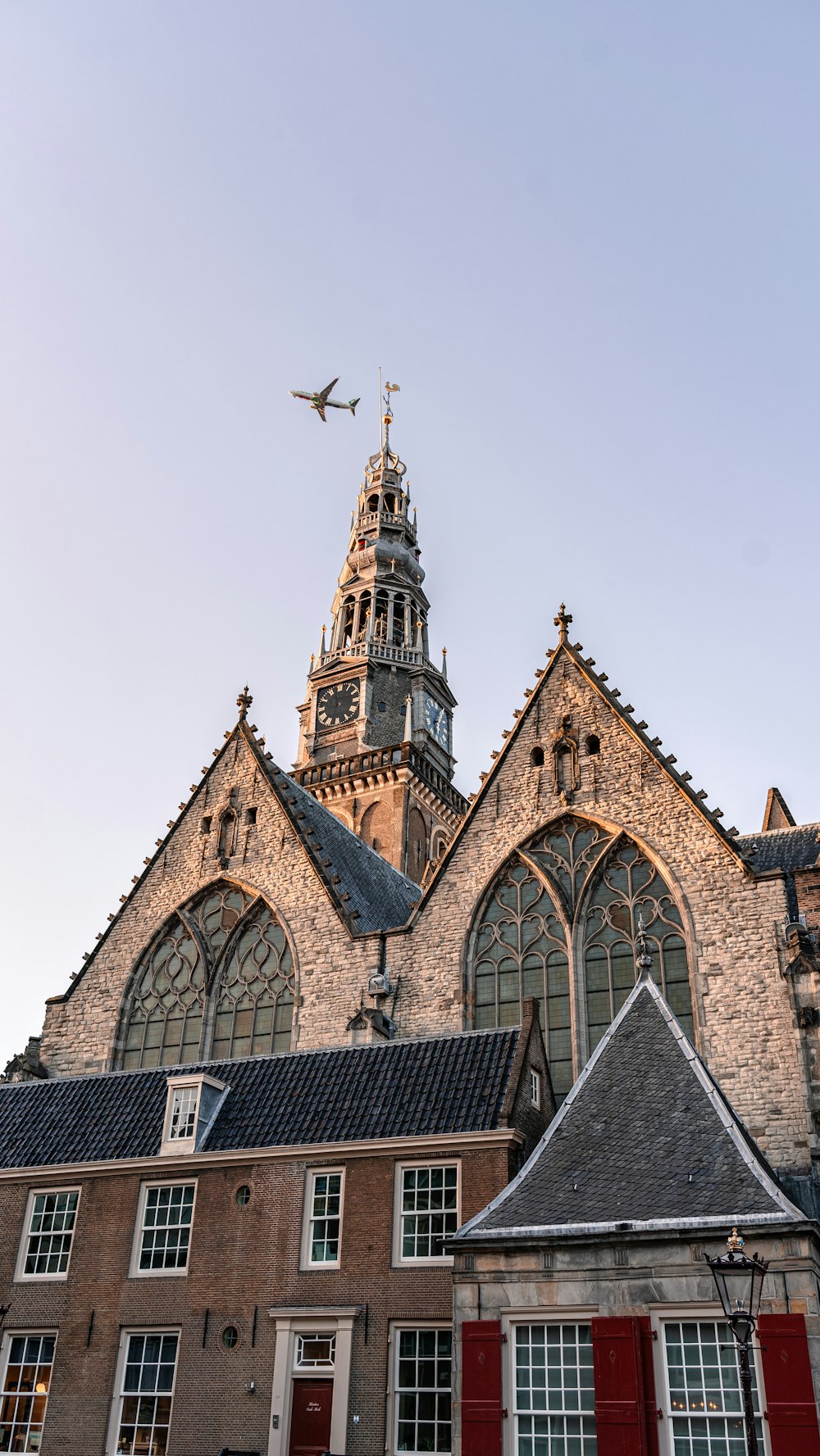 a church with a plane flying over it