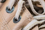 Close-up of a scuffed sneaker before cleaning, showing dirt and wear.