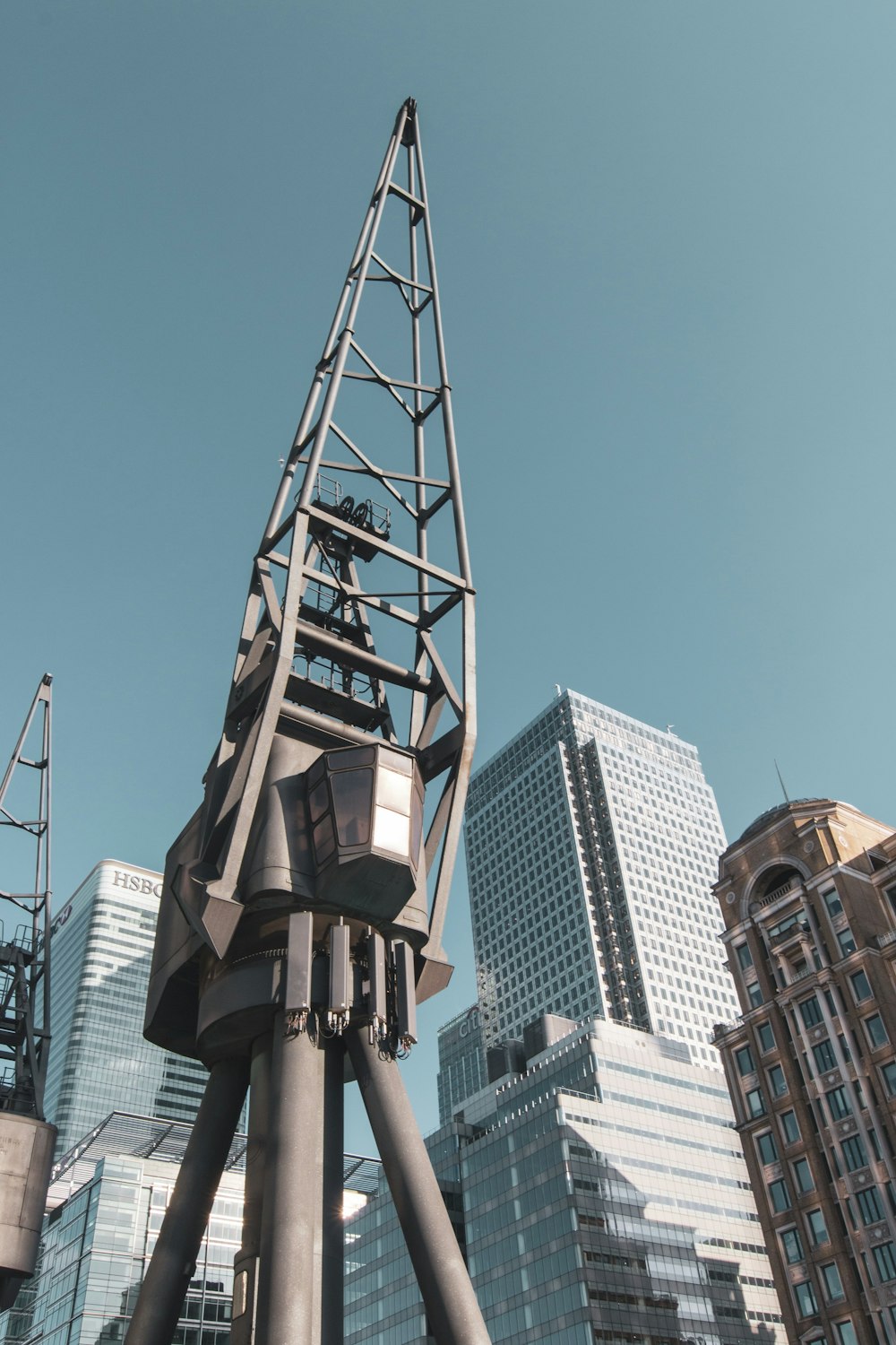 a tall metal structure in the middle of a city