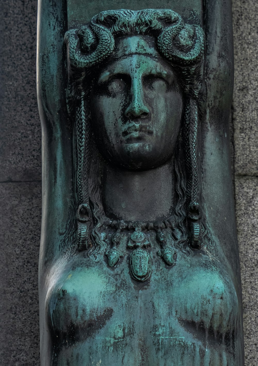 a close up of a statue of a woman's head