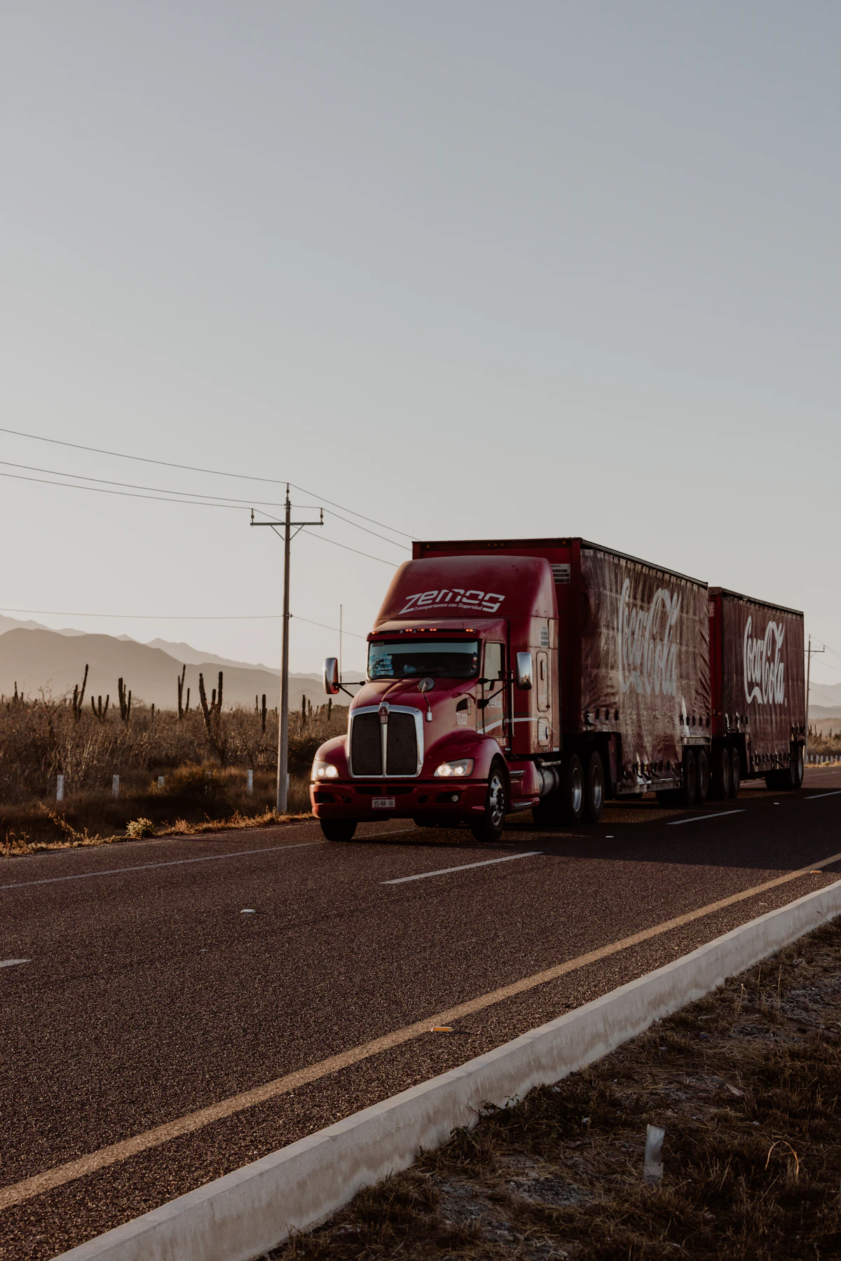 Red commercial truck on the highway