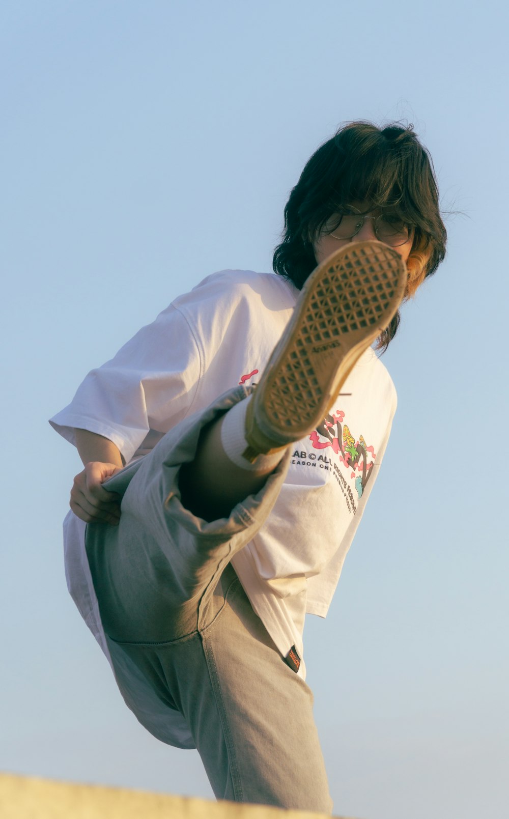 a young man is doing a trick on a skateboard