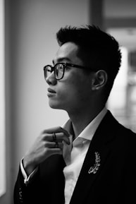 A thoughtful recruiter reviewing candidate profiles with a focused expression.