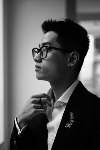 A thoughtful recruiter reviewing candidate profiles with a focused expression.