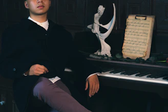 Historic portrait of Jules-Auguste Bordier at the piano in a vintage setting.