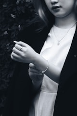 Black and white reflection palette bracelet worn by a hairstylist during a busy session.