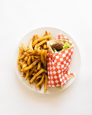 a plate with a sandwich and fries on it