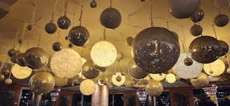 A collection of chic lighting fixtures casting inviting glows in a renovated space.