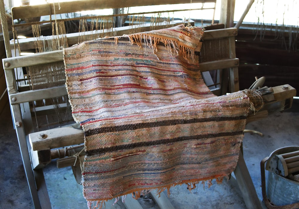 a weaving machine with a blanket on top of it
