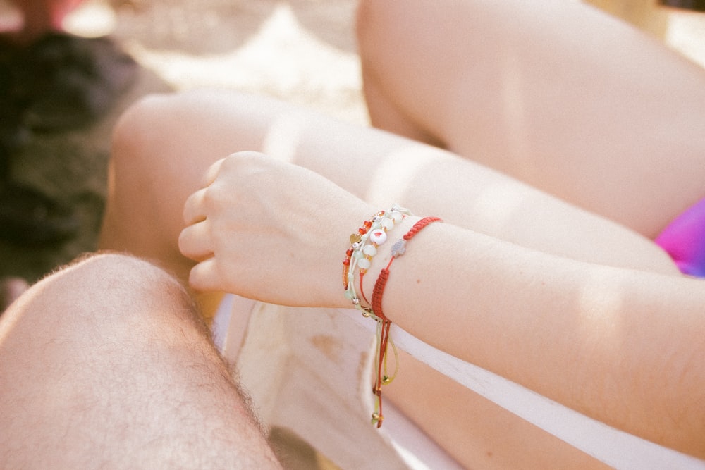 a close up of a person wearing a bracelet