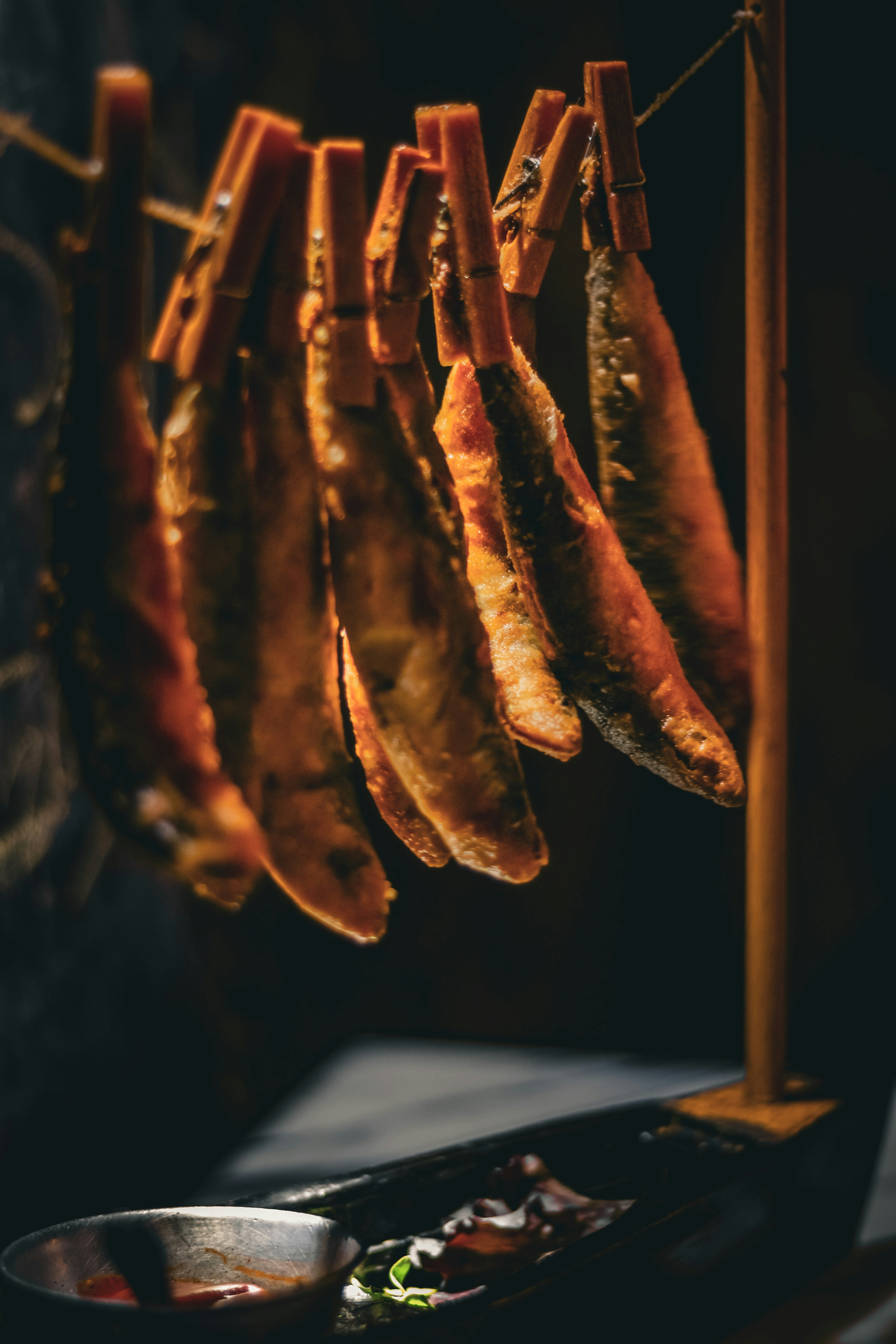 a bunch of food hanging from a line
