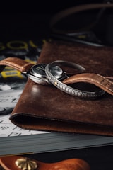 Classic vintage watch with a metal bracelet placed on an old book