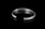 A silver bracelet with embossed patterns resting on a glossy black surface. The inside of the bracelet is engraved with the text 'COPPERTIST.WU' and a series of numbers. The bracelet has an open-ended design and the surface reflects light, enhancing its lustrous appearance.