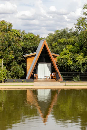 a small house sitting on top of a lake