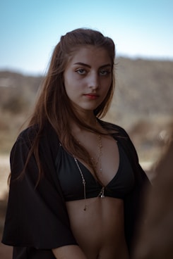 a woman in a bikini posing for a picture