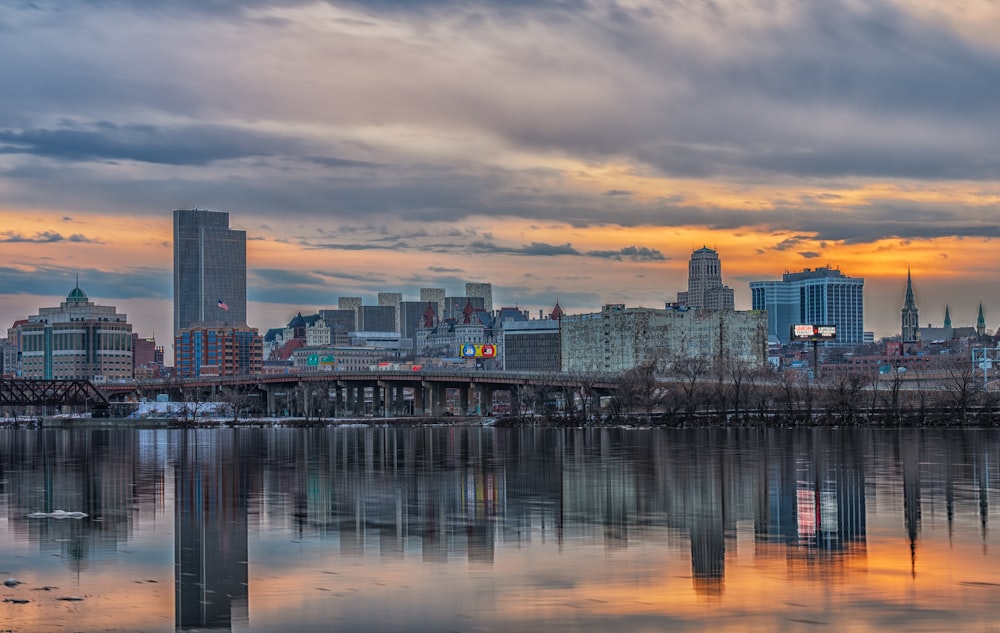 a large body of water with a city in the background