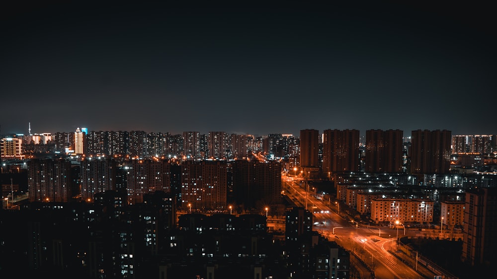 a view of a city at night from the top of a building