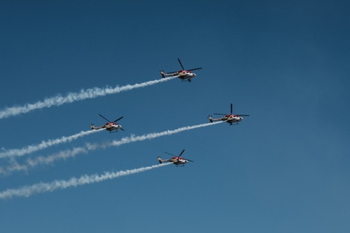 A fleet of UAVs coordinating in formation over a disaster-stricken area.