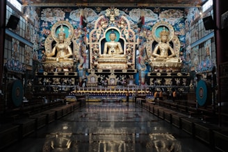 a large room with a statue of buddha in it