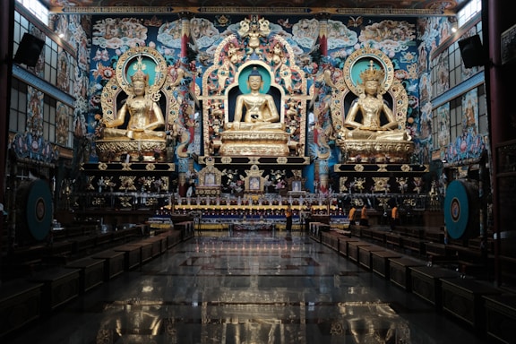 a large room with a statue of buddha in it
