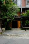 Hotel exterior showcasing a welcoming entrance with lush greenery.