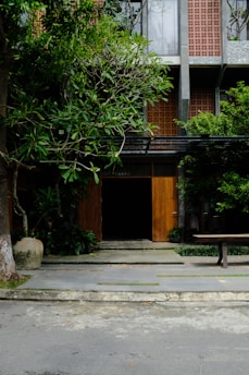 A modern home exterior with a welcoming entrance and lush greenery.